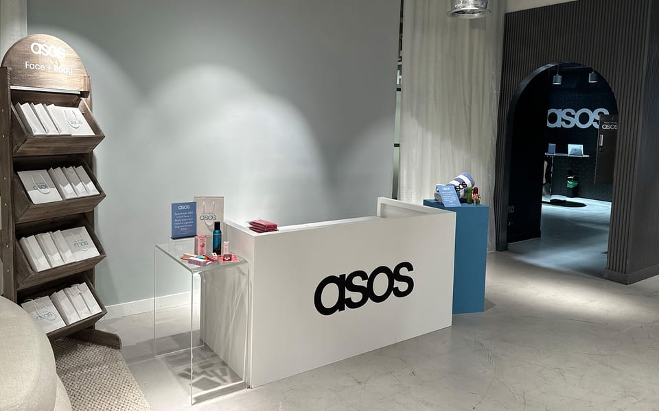 An ASOS Face + Body event space with a branded reception desk