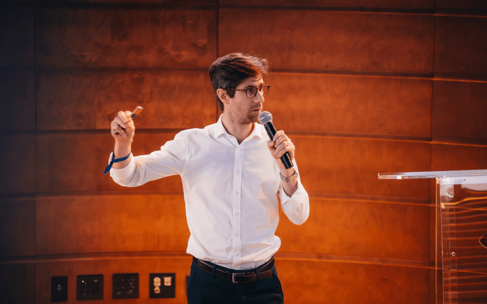 Baptiste Collot, co-founder and chief executive of Trustpair, speaking at a company event