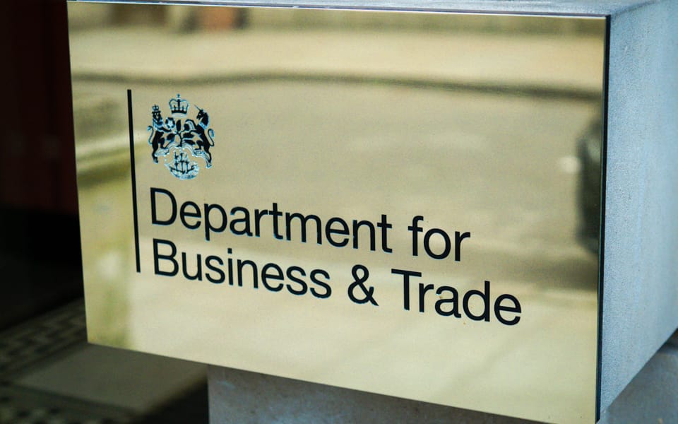 Department for Business and Trade sign on a brass plaque