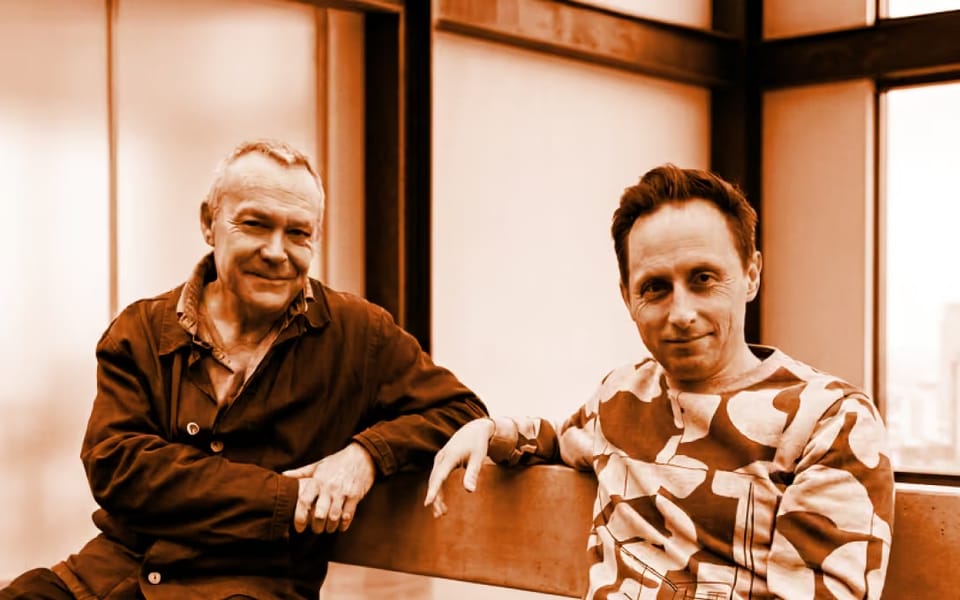 Alex Wade and David Burgess, co-chief executives of ClearDraft, seated on a bench