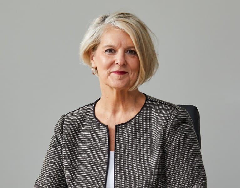 Michelle Senecal de Fonseca, chief executive of Redcentric, seated at a desk in a patterned jacket