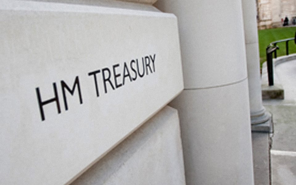 HM Treasury name carved on the stone entrance of its London building