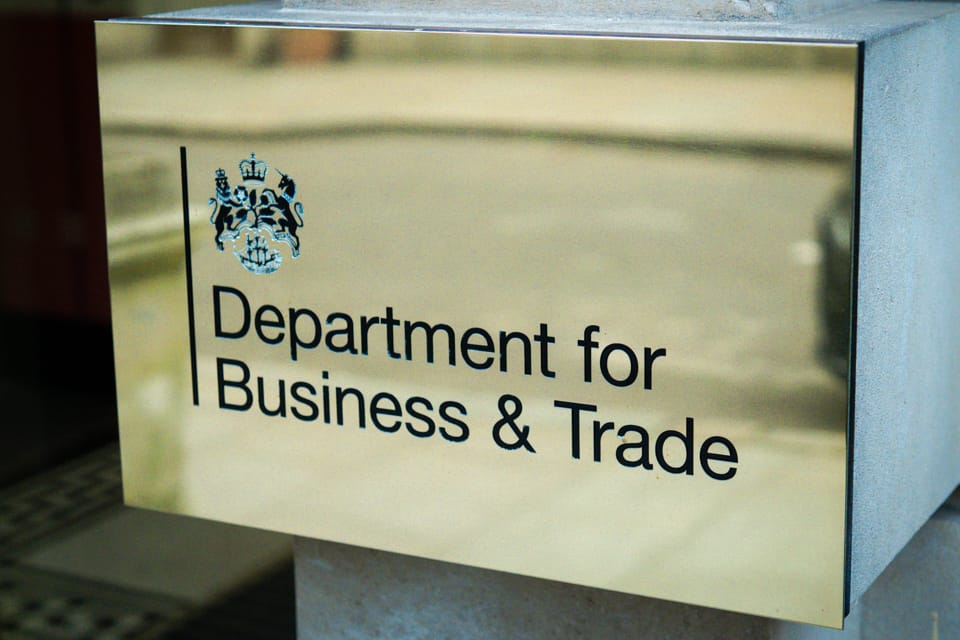 Department for Business and Trade sign on a brass plaque