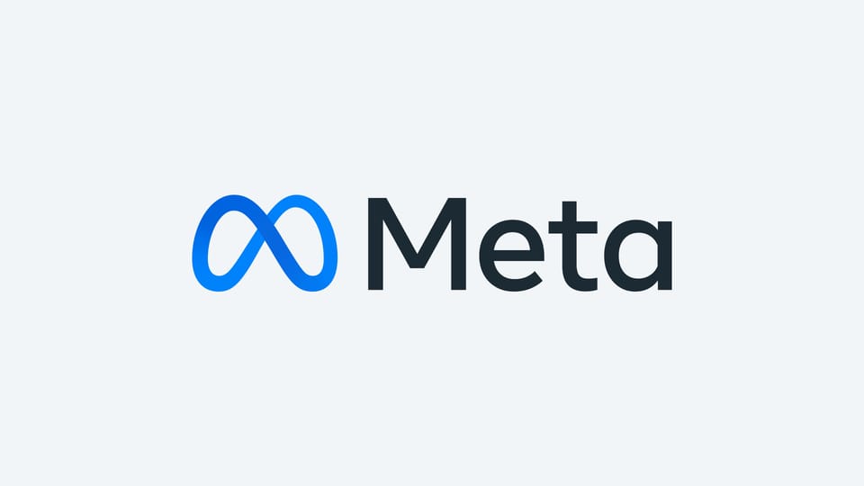 The Meta logo, a blue infinity loop beside the word Meta in dark type, on a pale grey background