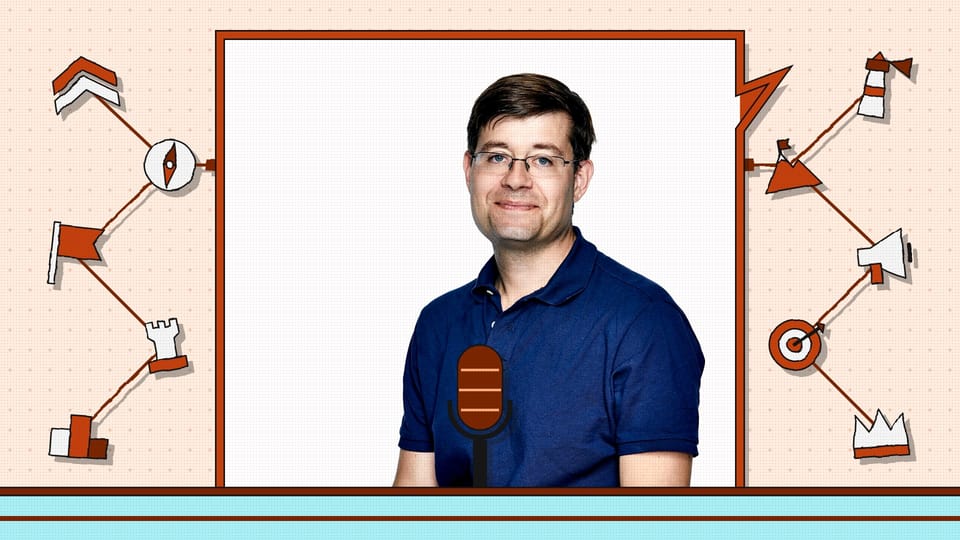 Justin Osofsky, chief operating officer of Nscale, in a burnt orange VETTDD frame