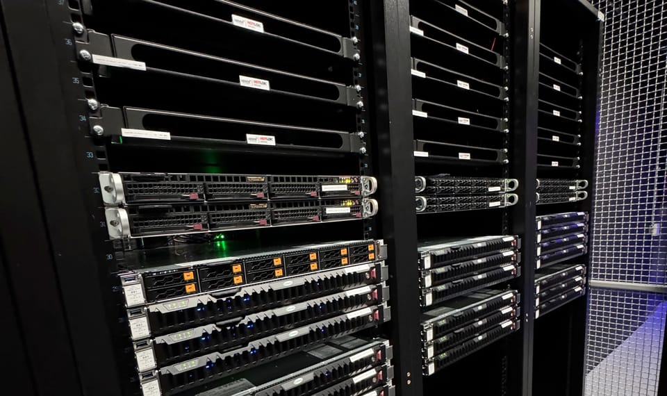 Server racks in Railway's own data center cage
