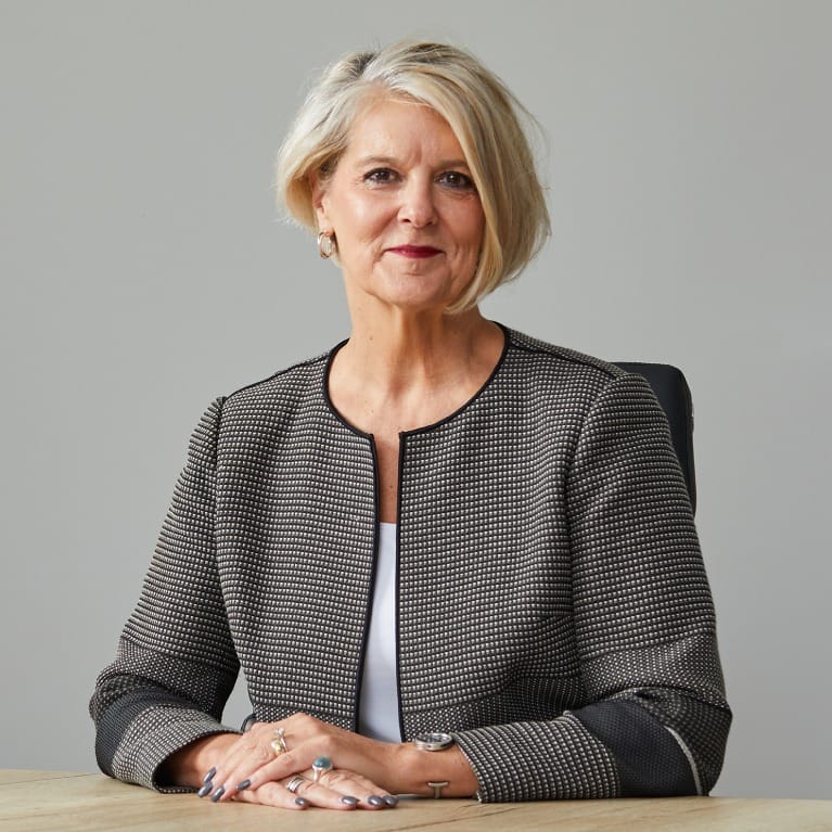 Michelle Senecal de Fonseca, chief executive of Redcentric, seated at a desk in a patterned jacket